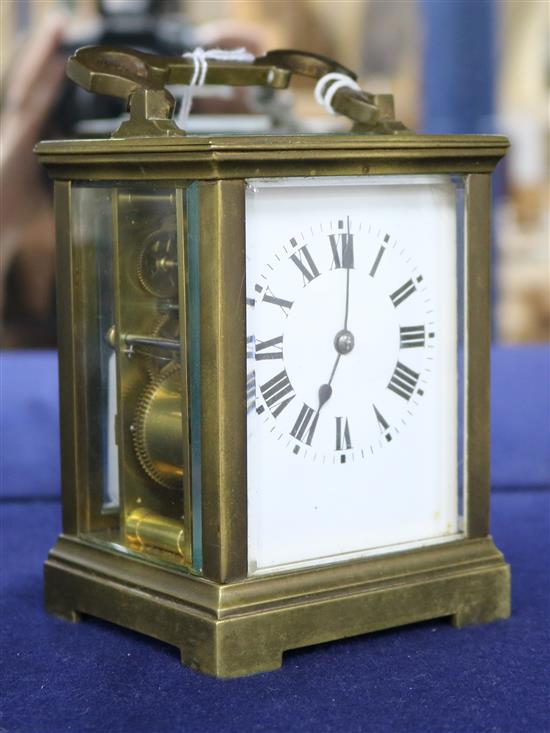 A gilt brass carriage clock, late 19th/early 20th century, with 8-day movement and white-enamelled dial,